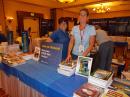 ARRL Membership Manager, Diane Petrilli, KB1RNF (right) and Customer Service Manager, Amy Hurtado, KB1NXO, set up a pile of books and other goodies.